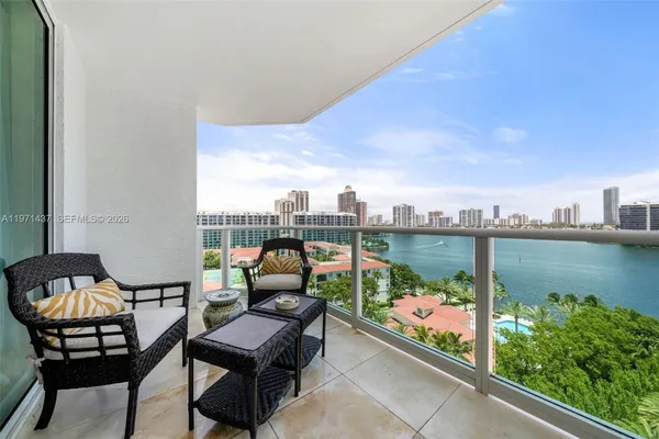 a roof deck with table and chairs