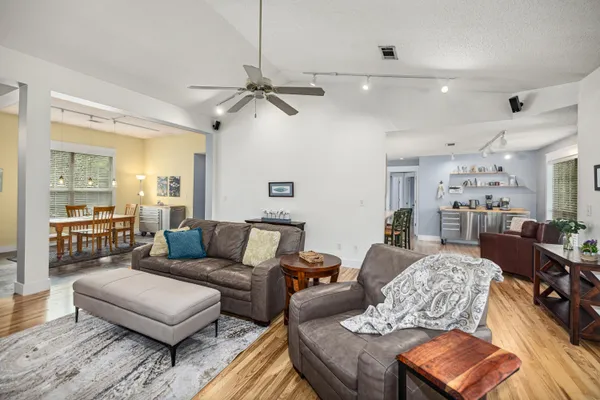a kitchen with stainless steel appliances granite countertop a sink and a microwave