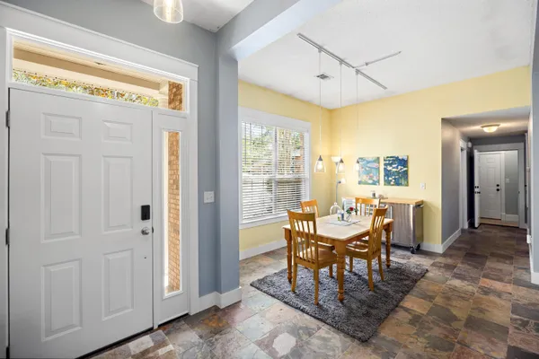 a living room with furniture fireplace and window