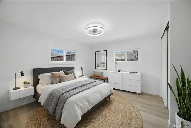 a bedroom with a bed and a desk