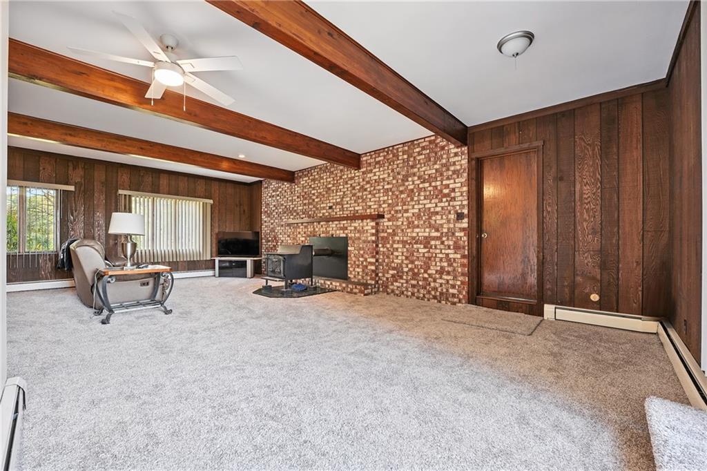 257 Halltown Road Wampum, PA 16157 - Photo 7 of 9 a view of an empty room and fire place