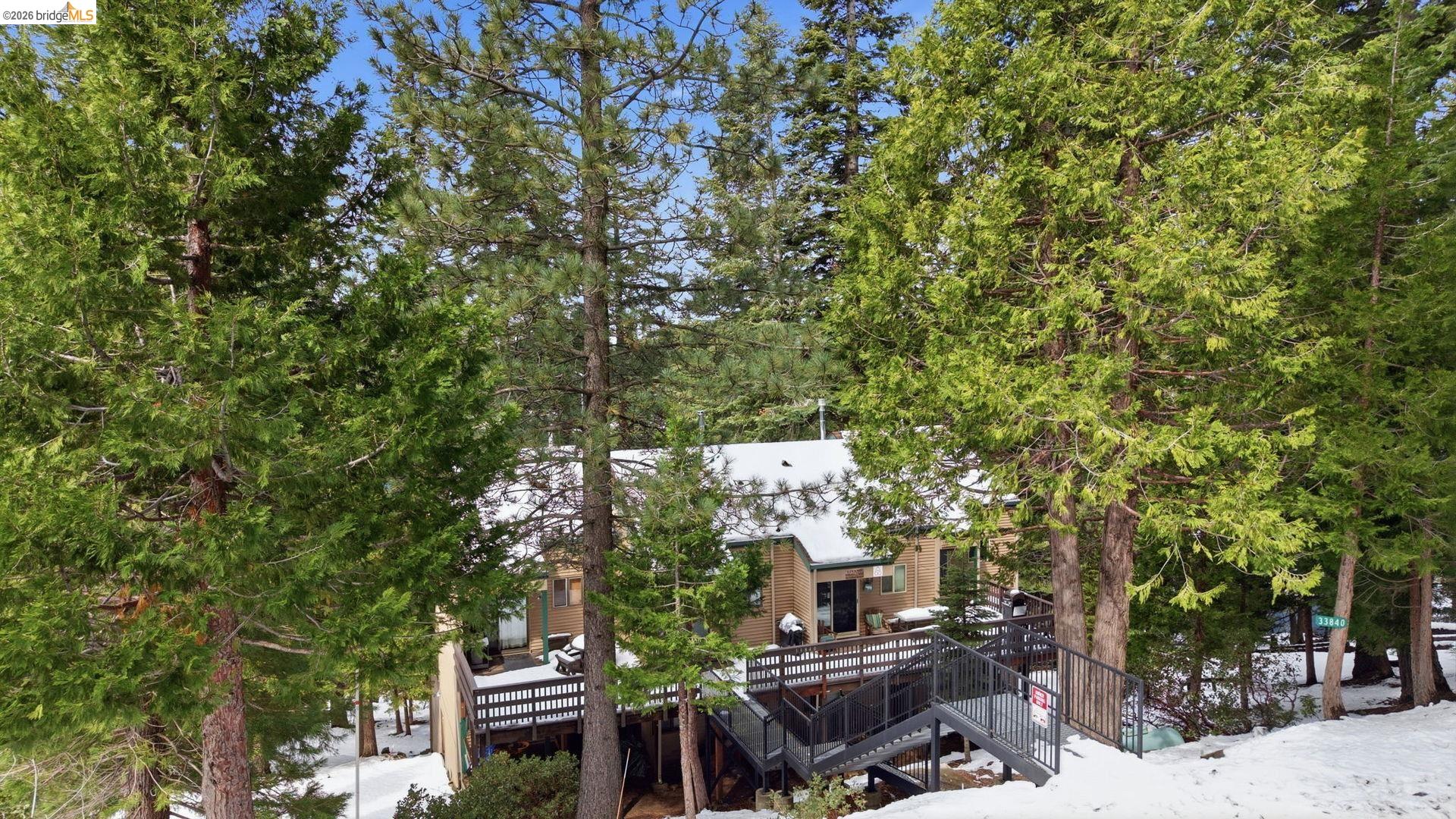 33840 Upper Leland Road, Unit 25A Pinecrest, CA 95364 - Photo 27 of 41 a view of a city with lush green forest