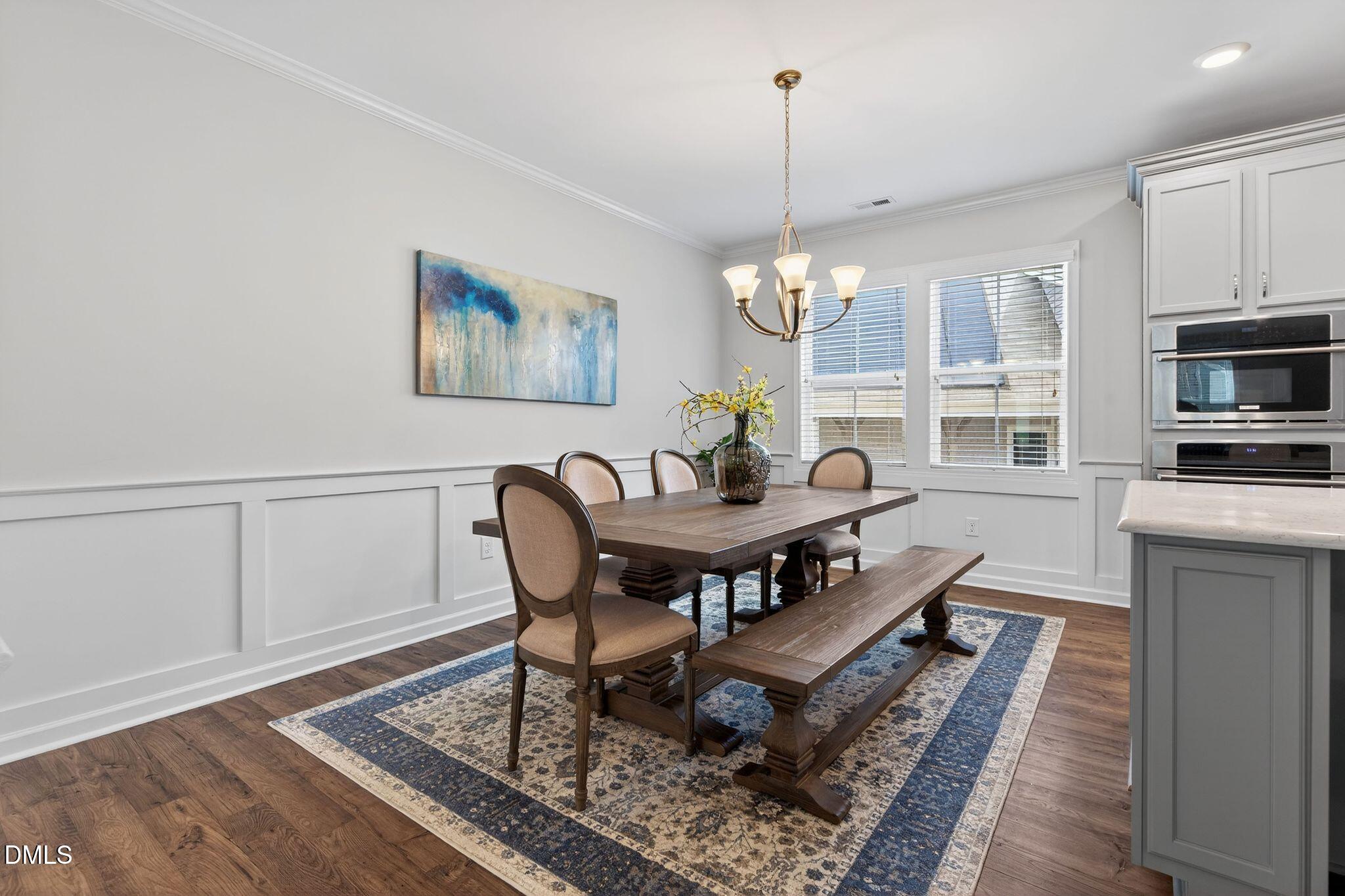 528 Spring Flower Court Cary, NC 27511 - Photo 13 of 51 a dining room with furniture and window