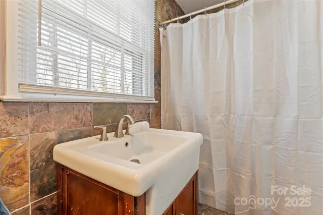 a white sink sitting next to a white sink