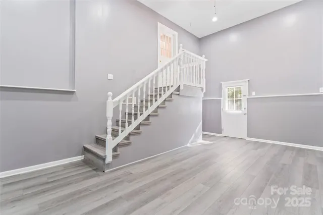 a view of entryway with wooden floor