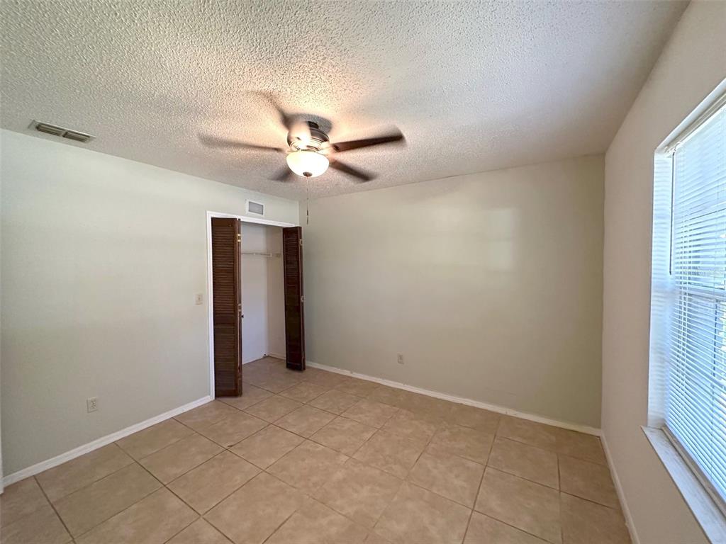 5061 Barnegat Point Road Orlando, FL 32808 - Photo 17 of 33 a view of an empty room with a window