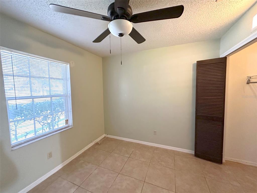 5061 Barnegat Point Road Orlando, FL 32808 - Photo 18 of 33 a view of an empty room with a window