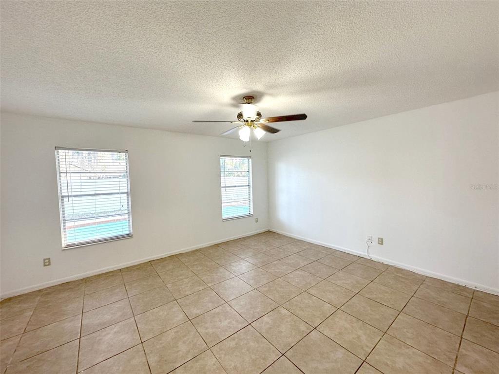 5061 Barnegat Point Road Orlando, FL 32808 - Photo 22 of 33 a view of an empty room with a window