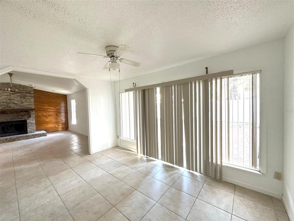 5061 Barnegat Point Road Orlando, FL 32808 - Photo 7 of 33 a view of an empty room with a window