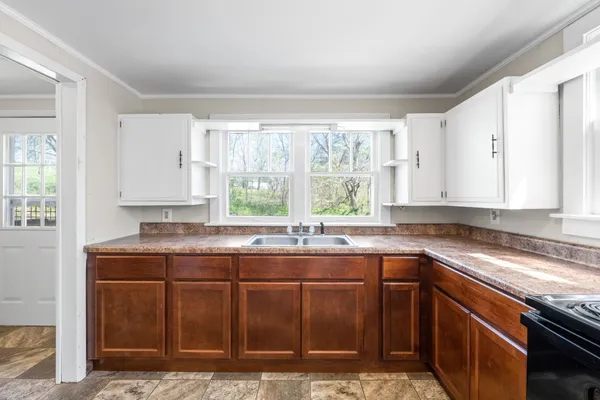 a kitchen with a sink and a window