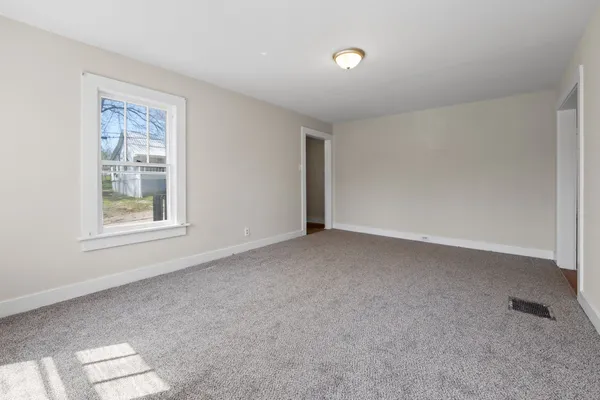 a view of a livingroom with wooden floor