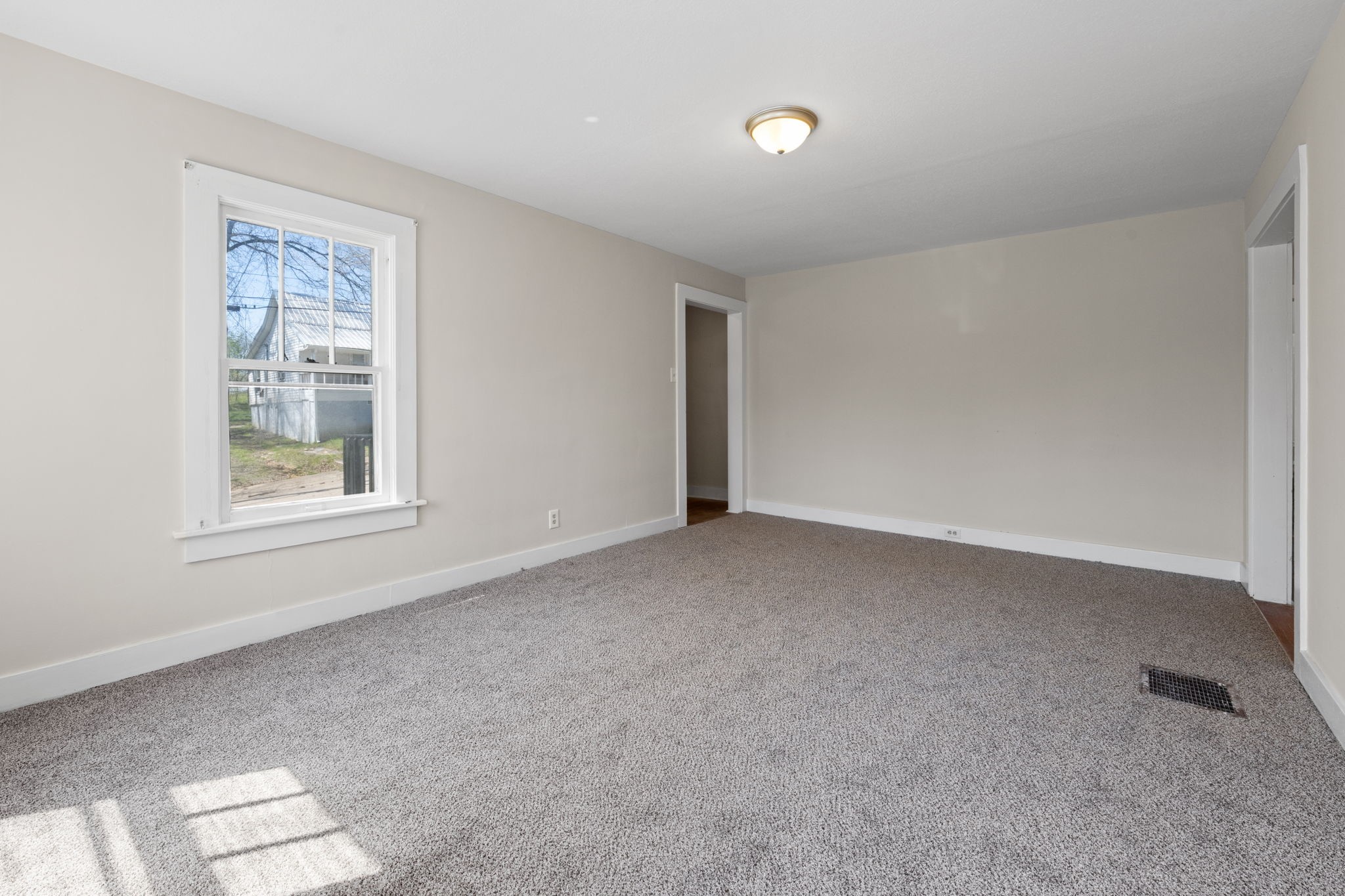 66 Monroe Street Cadiz, KY 42211 - Photo 9 of 15 a view of an empty room with a window