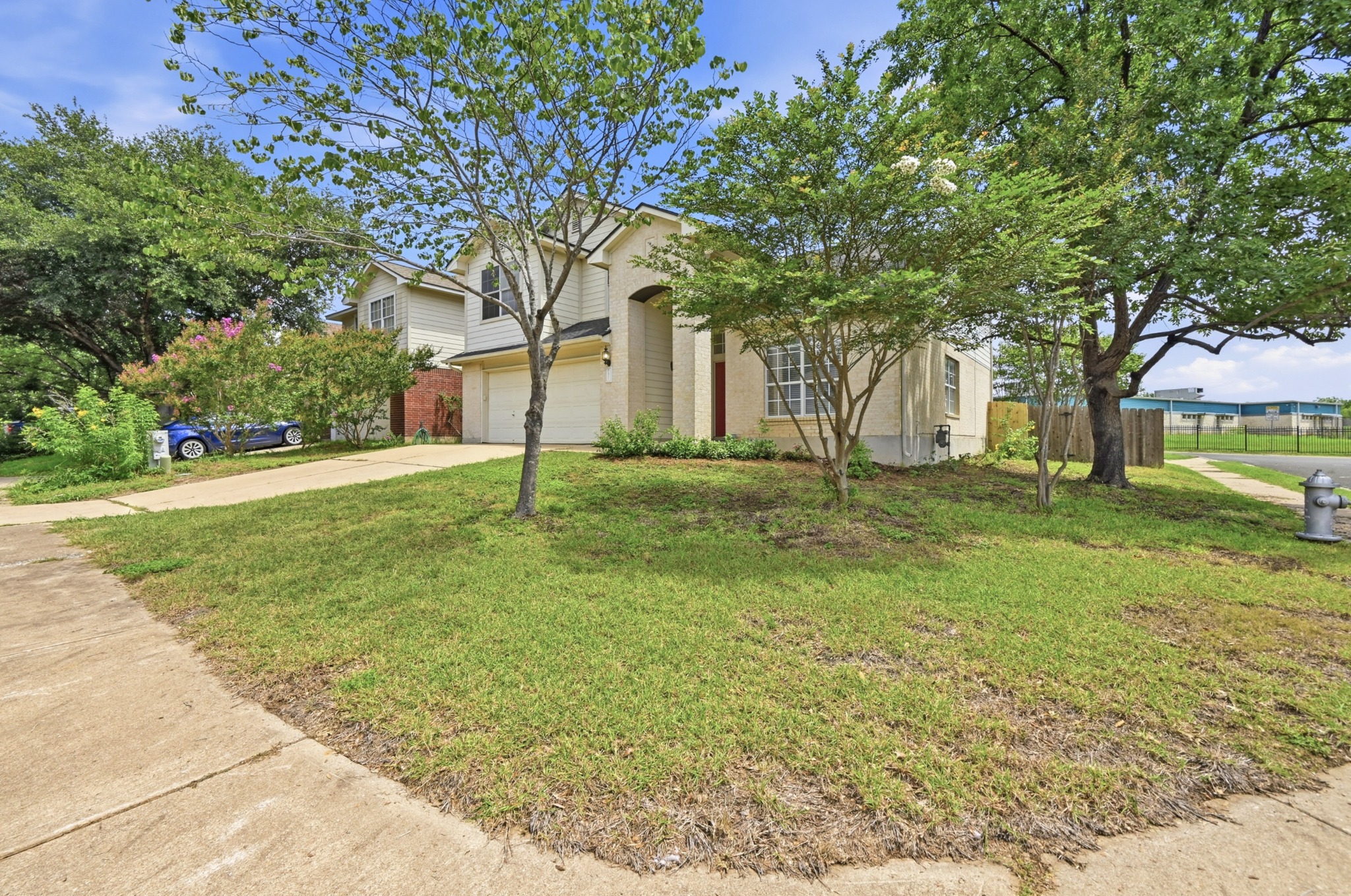 2700 Cradlerock Terrace Austin, TX 78748 - Photo 3 of 29 a tree in a yard next to a building