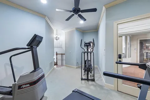 a view of a hallway with workspace and mirror
