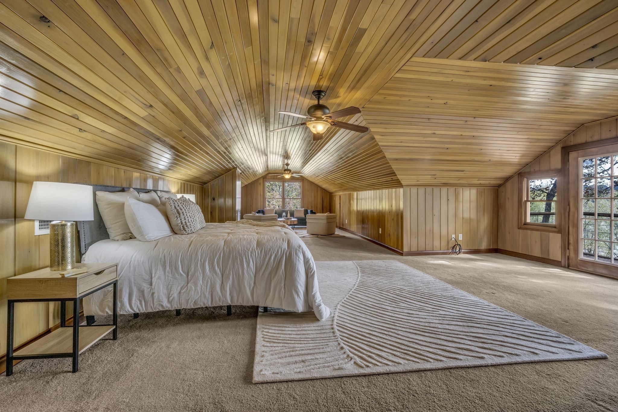 90 Bluff Point Lane Waverly, TN 37185 - Photo 18 of 60 a spacious bedroom with a bed and a chandelier