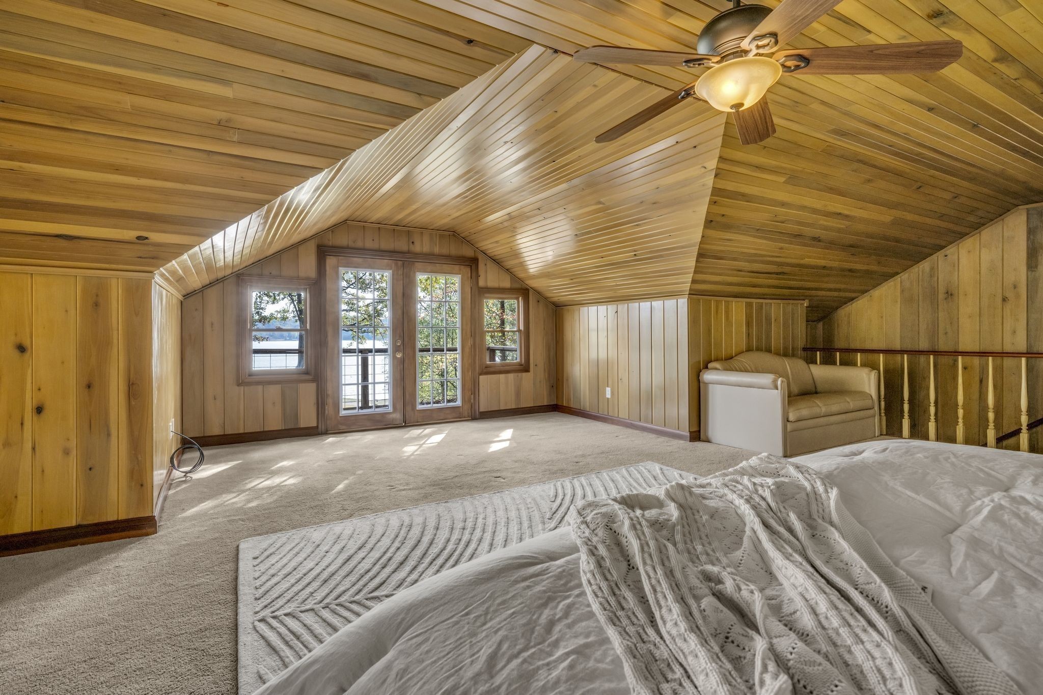 90 Bluff Point Lane Waverly, TN 37185 - Photo 21 of 60 a bedroom with a large bed and a chandelier