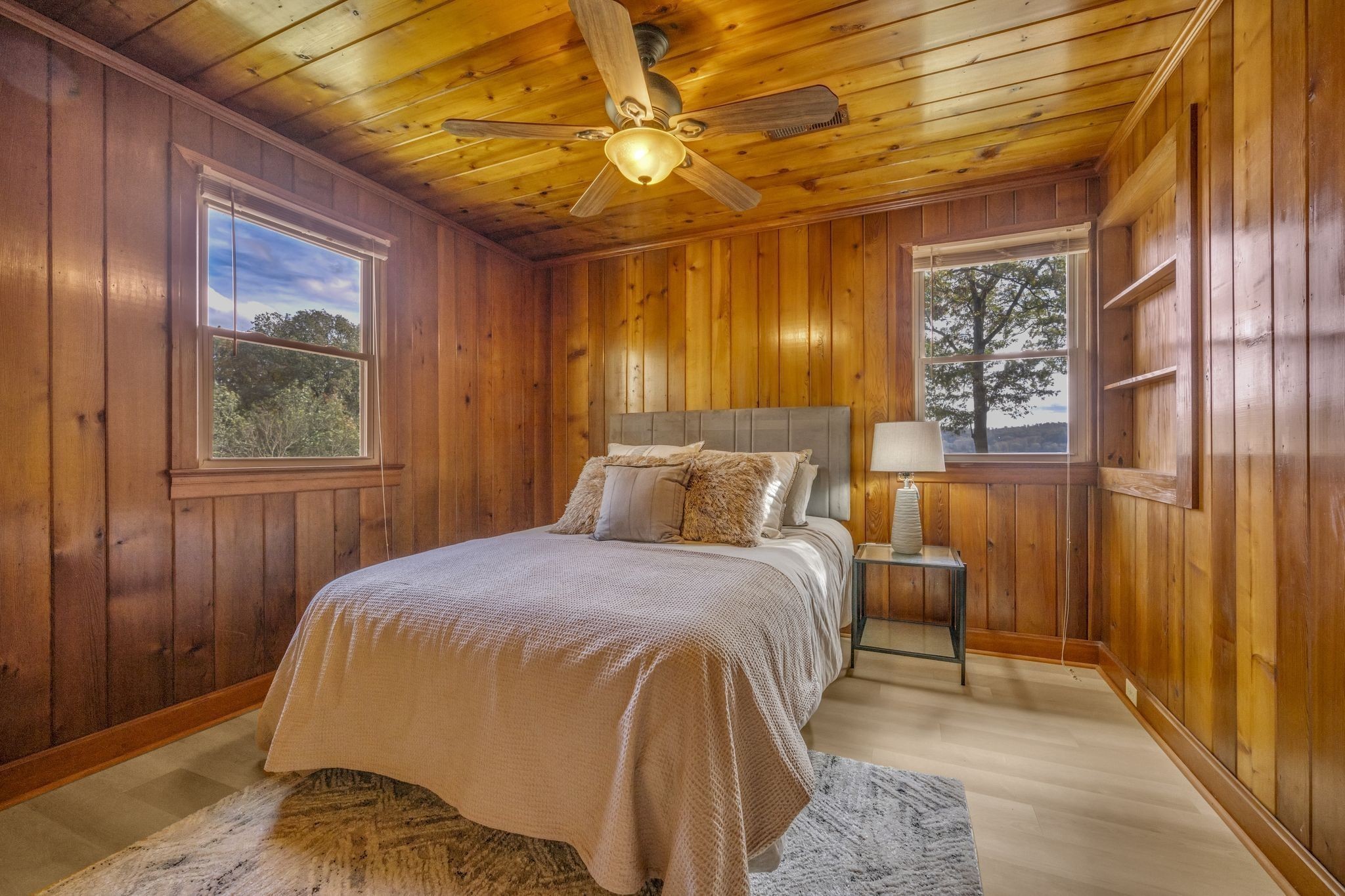 90 Bluff Point Lane Waverly, TN 37185 - Photo 34 of 60 a bedroom with a bed and a chandelier