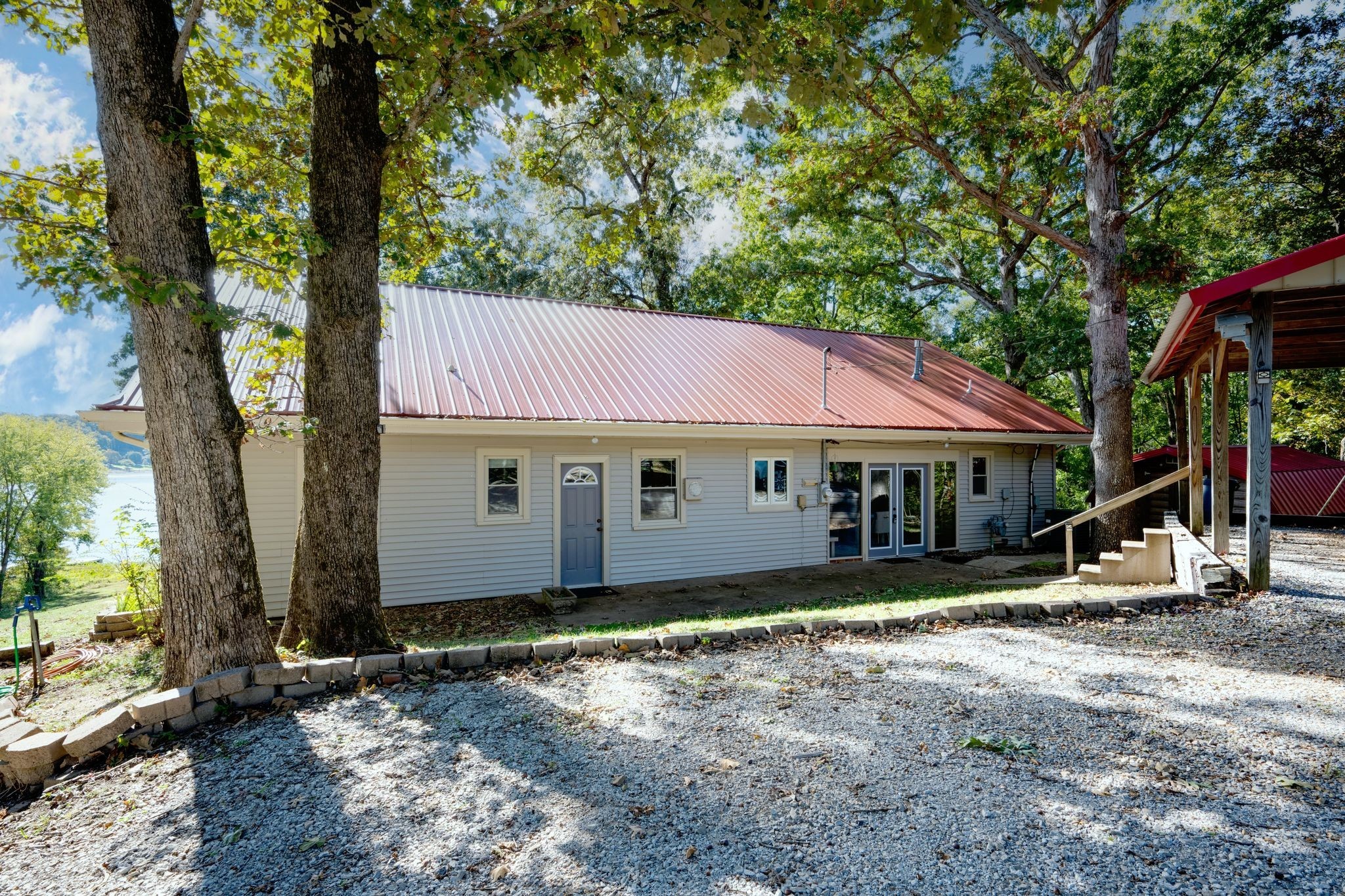 90 Bluff Point Lane Waverly, TN 37185 - Photo 49 of 60 a view of a house with large tree and wooden fence