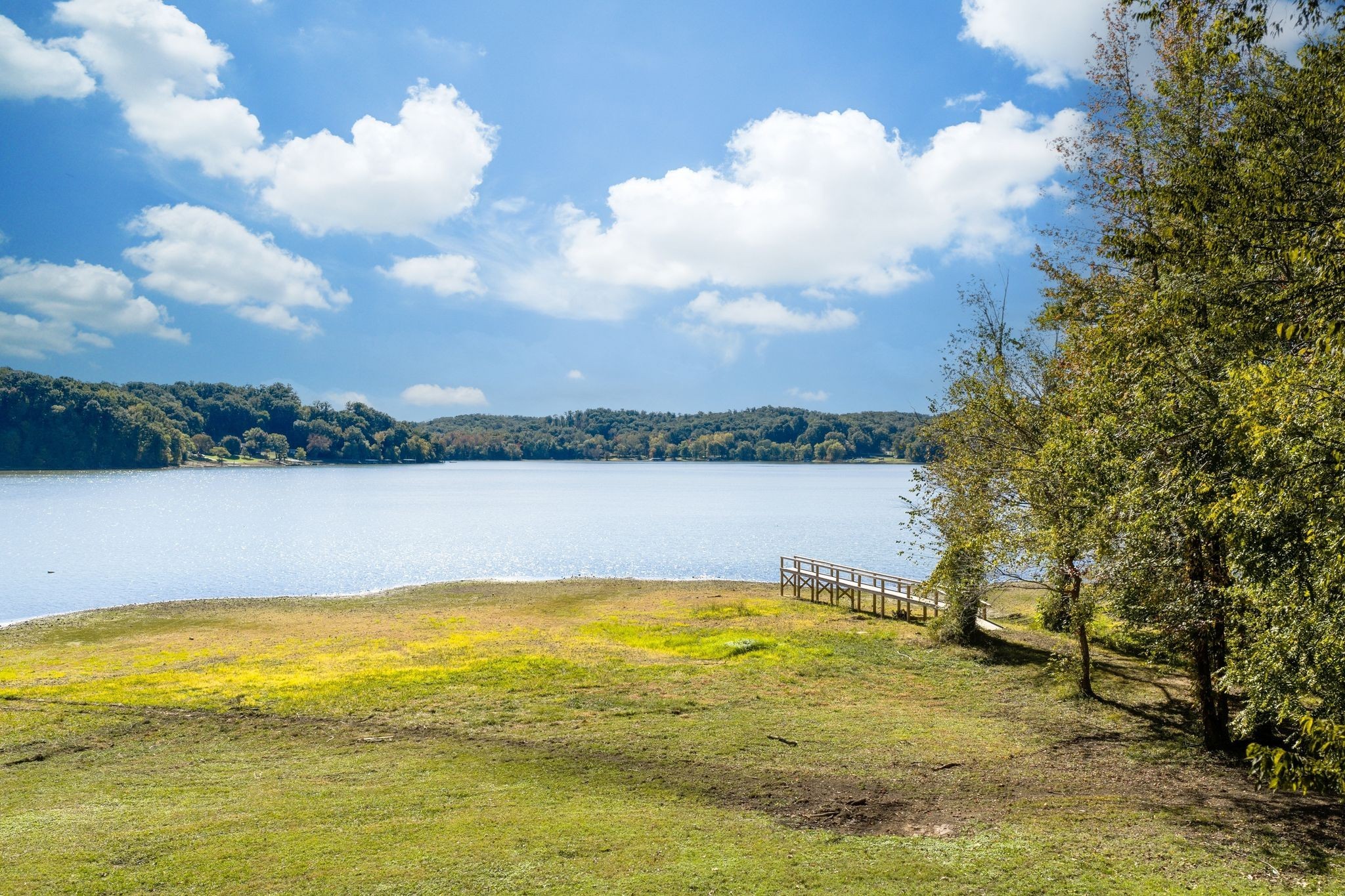 90 Bluff Point Lane Waverly, TN 37185 - Photo 57 of 60 a view of a lake with houses in the background