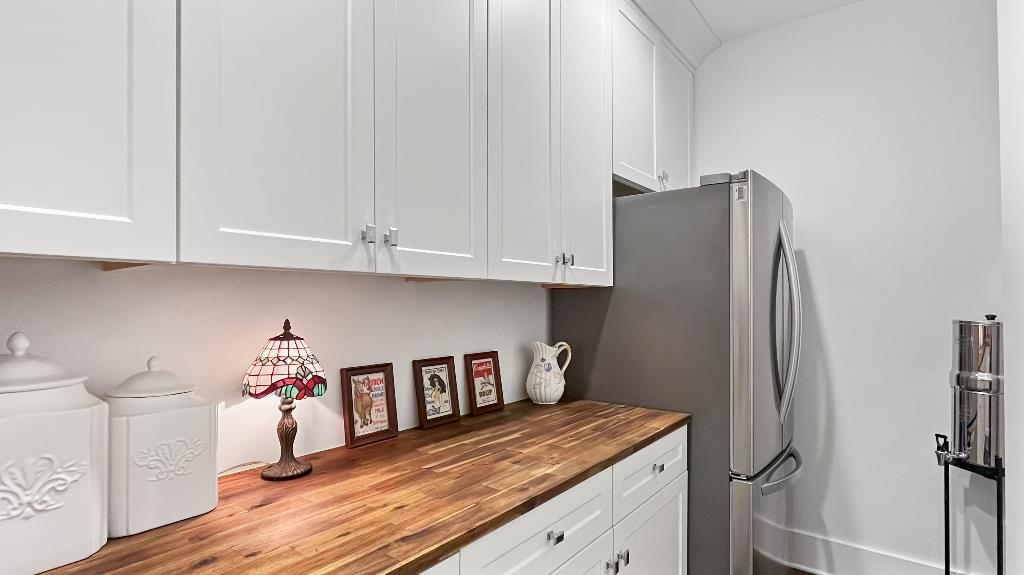 335 Blain Road Rossville, TN 38066 - Photo 14 of 38 a kitchen with stainless steel appliances granite countertop a refrigerator and a white cabinets