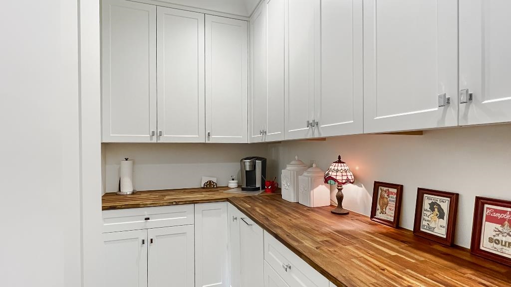 335 Blain Road Rossville, TN 38066 - Photo 15 of 38 a kitchen with granite countertop white cabinets and sink