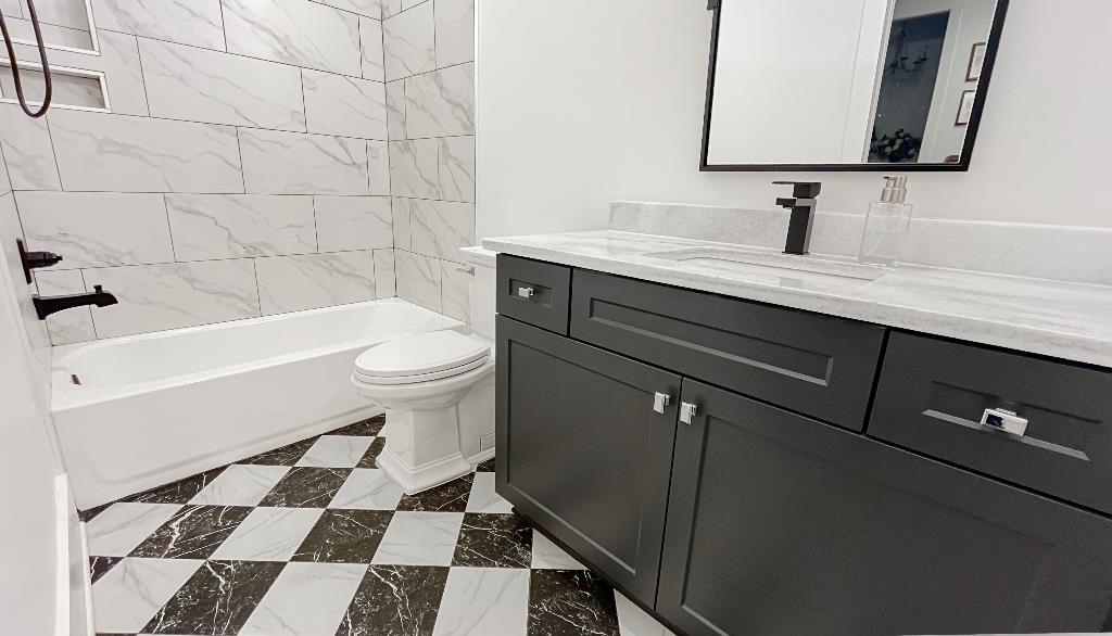 335 Blain Road Rossville, TN 38066 - Photo 26 of 38 a bathroom with a sink a toilet and a mirror