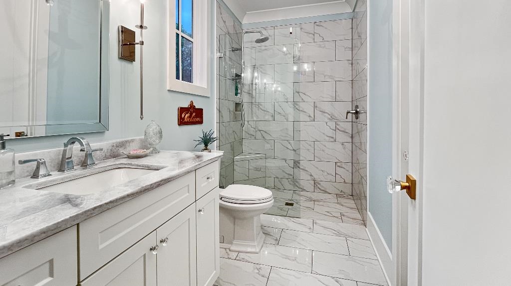 335 Blain Road Rossville, TN 38066 - Photo 28 of 38 a bathroom with a granite countertop sink toilet and shower