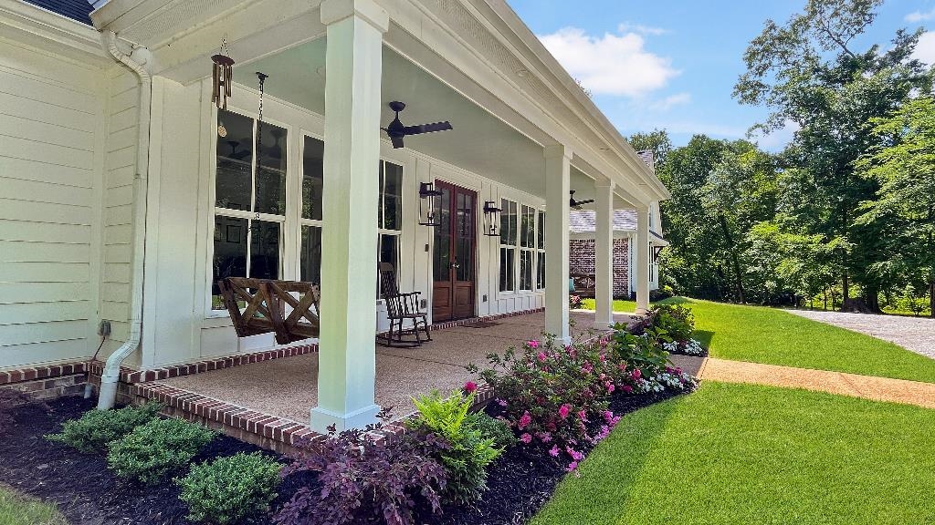 335 Blain Road Rossville, TN 38066 - Photo 34 of 38 a view of a patio with table and chairs potted plants