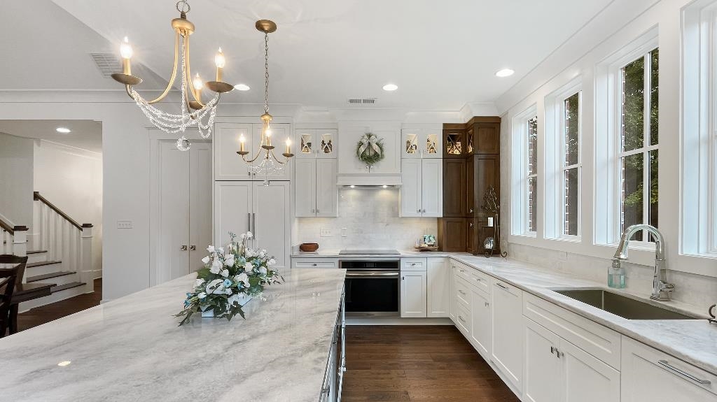 335 Blain Road Rossville, TN 38066 - Photo 10 of 38 a large kitchen with granite countertop a sink a counter and cabinets