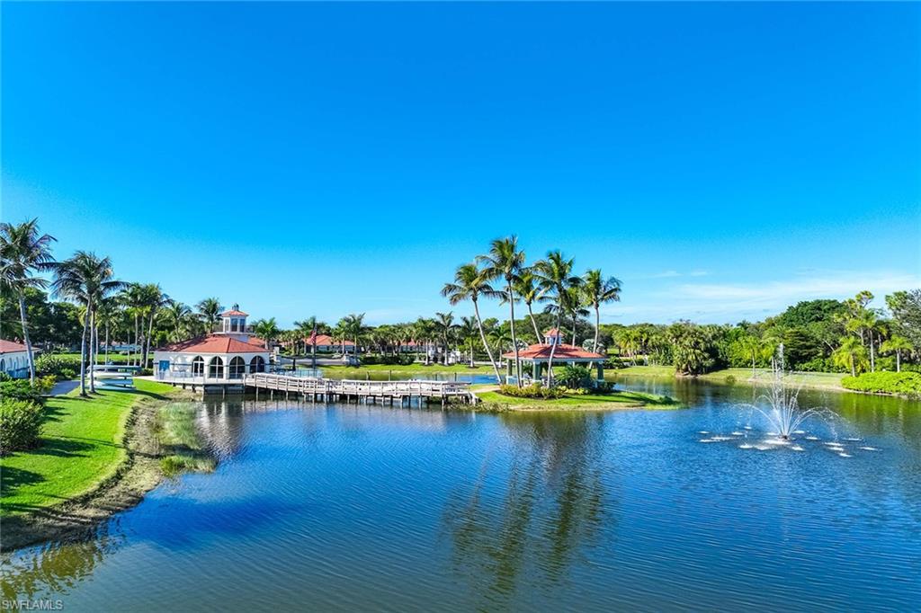 10801 Halfmoon Shoal Road, Unit 203 Estero, FL 34135 - Photo 44 of 50 a view of a lake with houses in all around