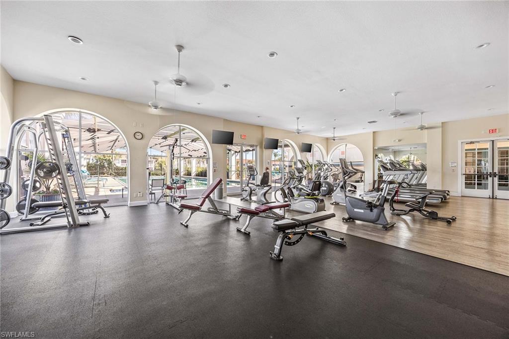 10801 Halfmoon Shoal Road, Unit 203 Estero, FL 34135 - Photo 47 of 50 a view of a room with gym equipment and a large window