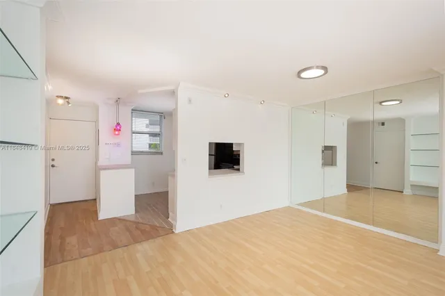 a view of a livingroom with wooden floor