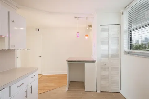 a view of cabinets with wooden floor