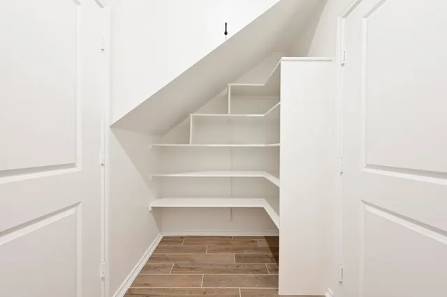 a view of staircase with white walls