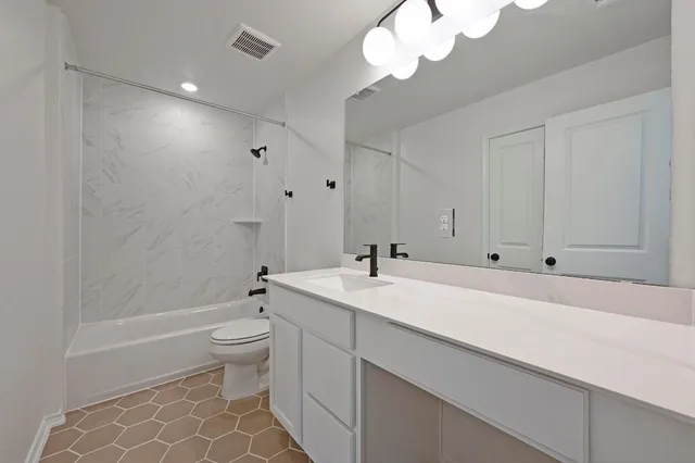 a bathroom with a sink a toilet and a bathtub