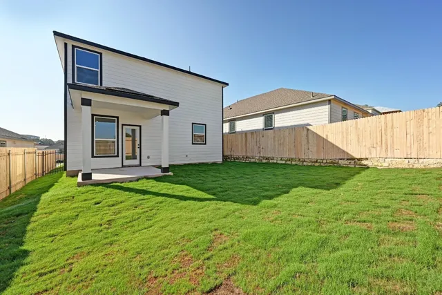 a view of a back yard of the house
