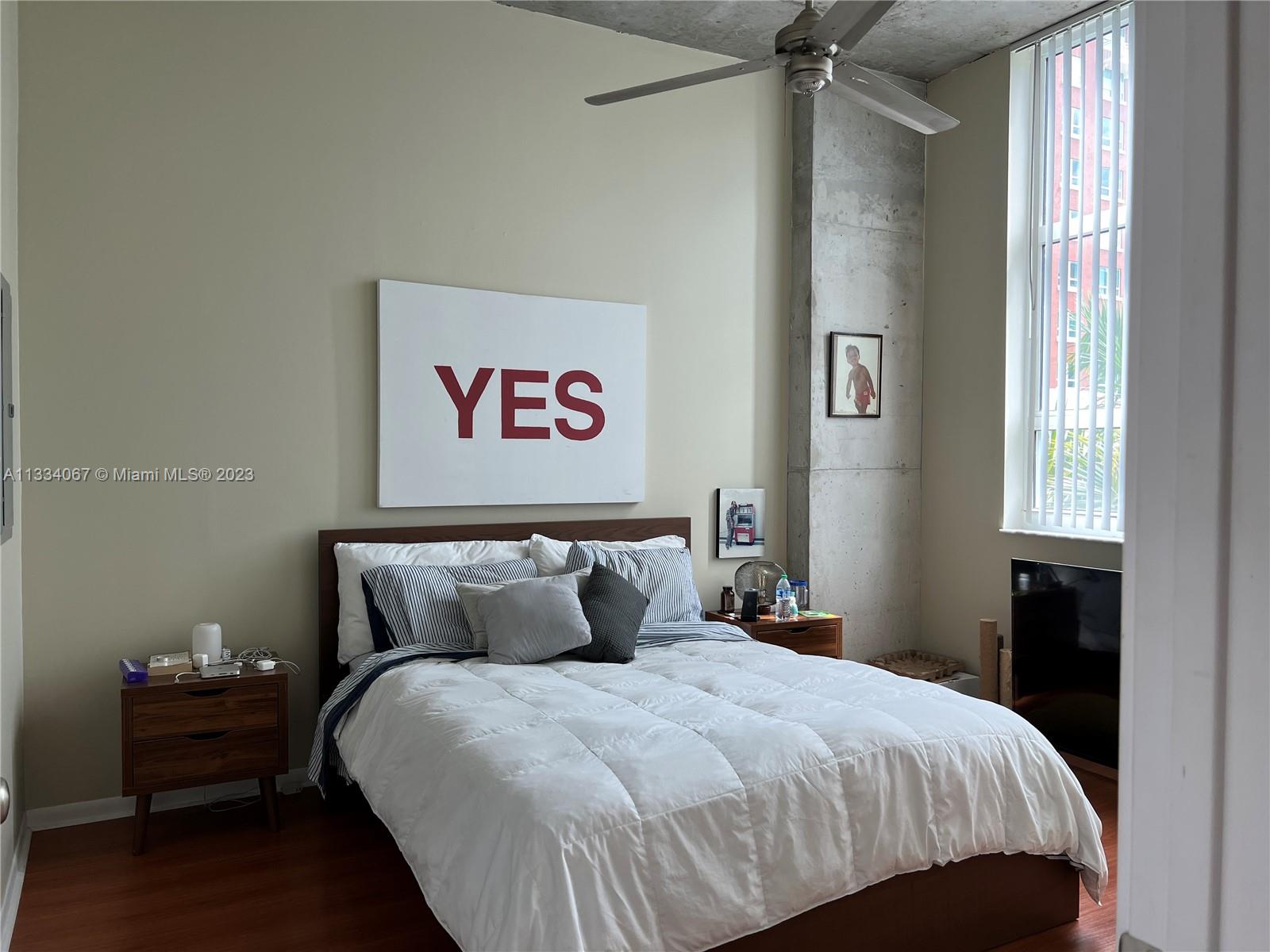 2001 Biscayne Boulevard, Unit 2503 Miami, FL 33137 - Photo 11 of 22 a bedroom with a bed and a window