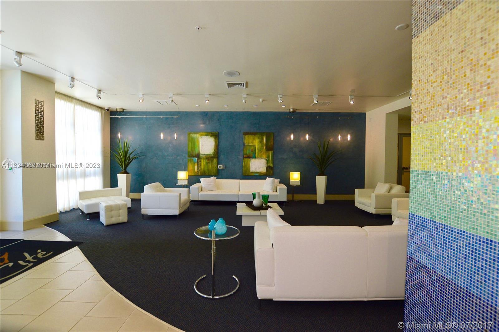 2001 Biscayne Boulevard, Unit 2503 Miami, FL 33137 - Photo 18 of 22 a living room with furniture and wooden floor