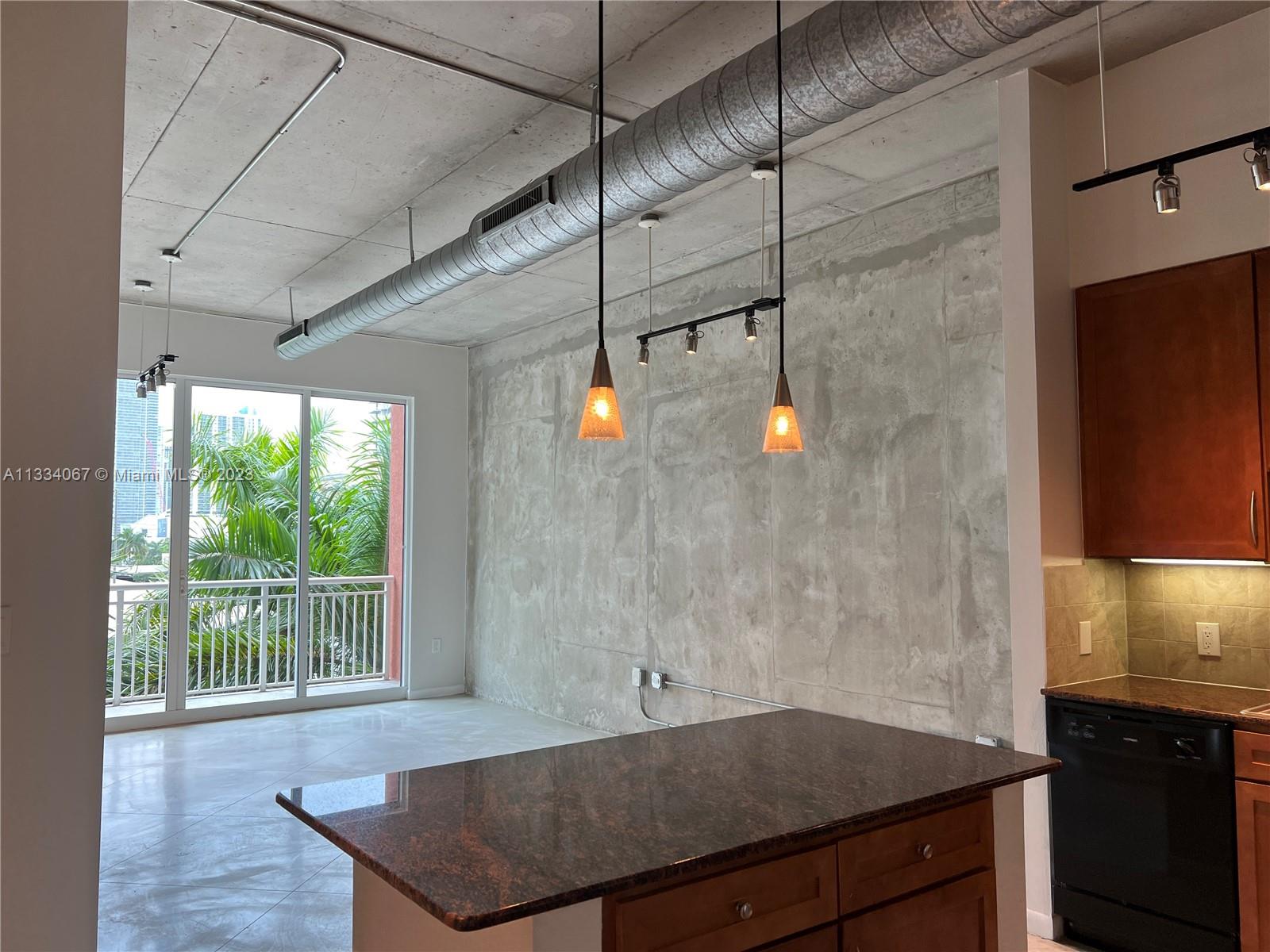 2001 Biscayne Boulevard, Unit 2503 Miami, FL 33137 - Photo 3 of 22 a kitchen with a sink a counter top space and wooden floor