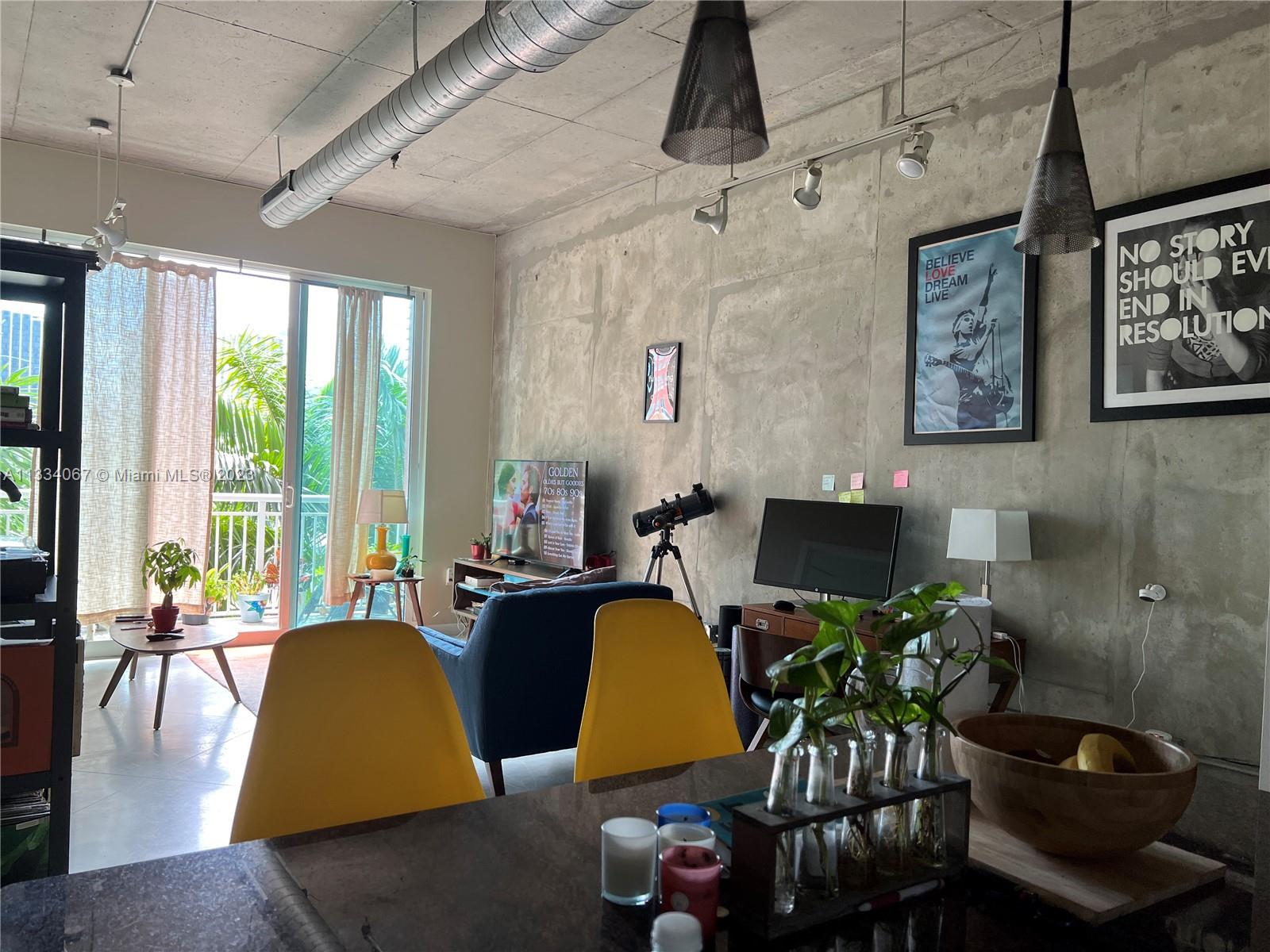 2001 Biscayne Boulevard, Unit 2503 Miami, FL 33137 - Photo 5 of 22 a view of a livingroom with furniture and a potted plant