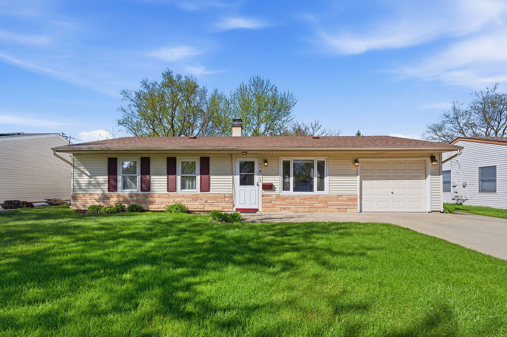 910 Meadow Lane Streamwood, IL 60107 - Photo 1 of 30 a front view of a house with a garden and yard
