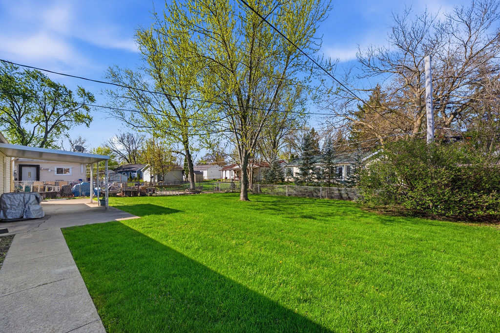 910 Meadow Lane Streamwood, IL 60107 - Photo 25 of 30 a view of a yard with a house