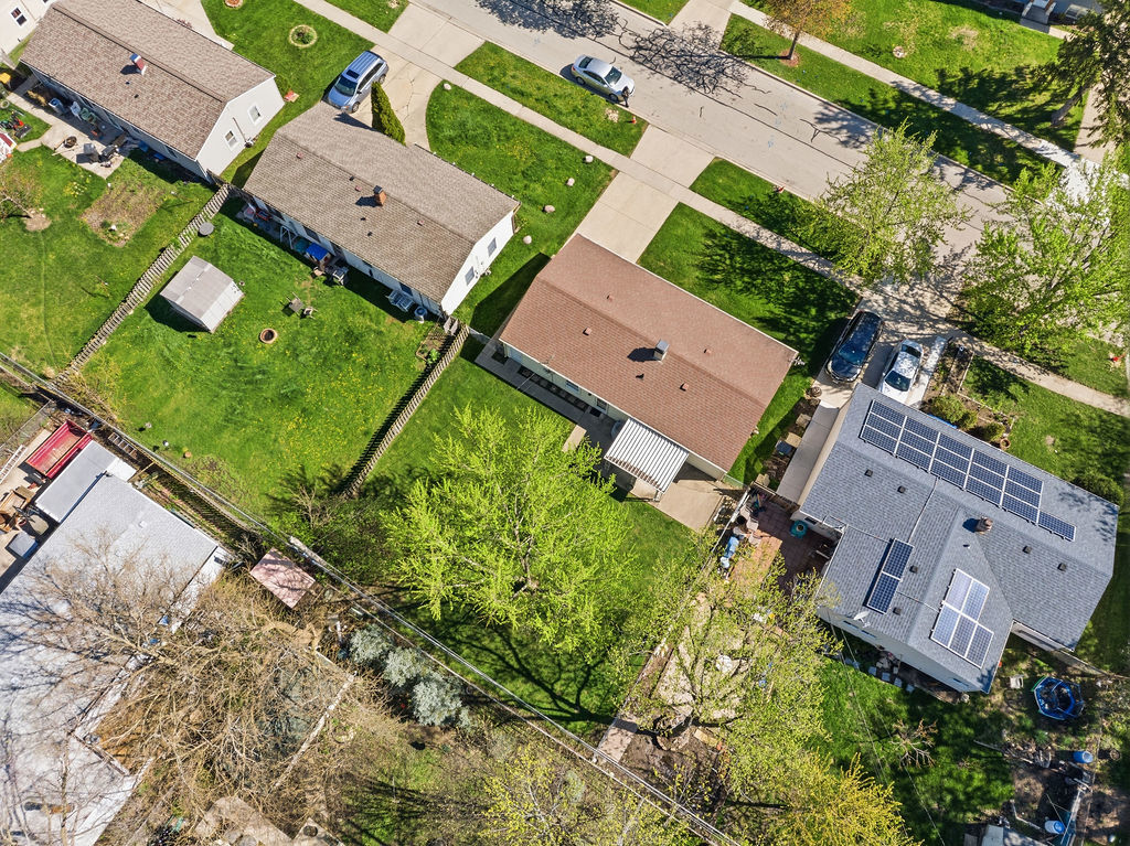 910 Meadow Lane Streamwood, IL 60107 - Photo 27 of 30 an aerial view of a house with a garden and trees