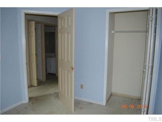 4501 Still Pines Drive Raleigh, NC 27613 - Photo 13 of 13 close view of an empty room with closet and wooden floor