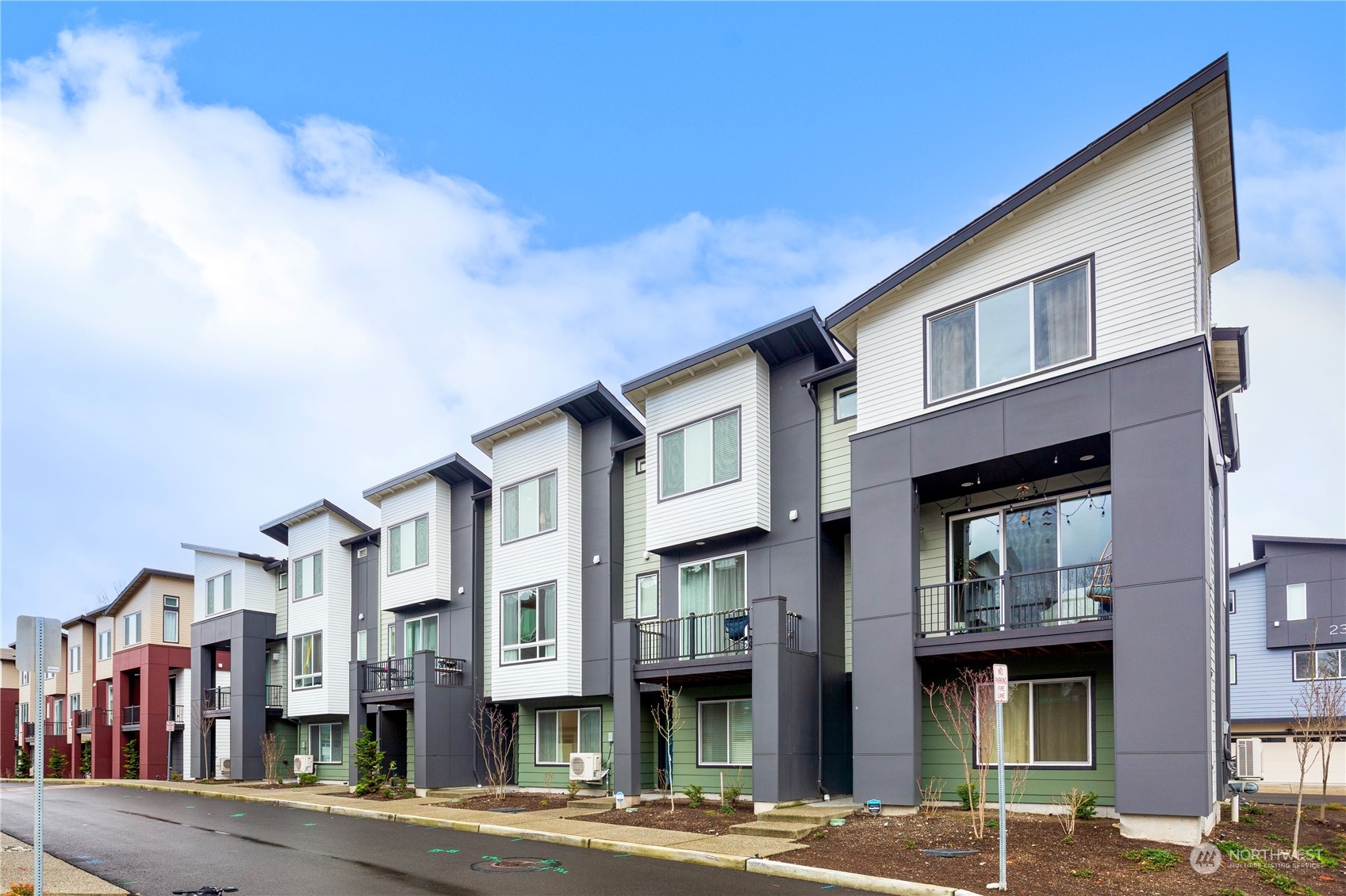 a front view of residential houses with street