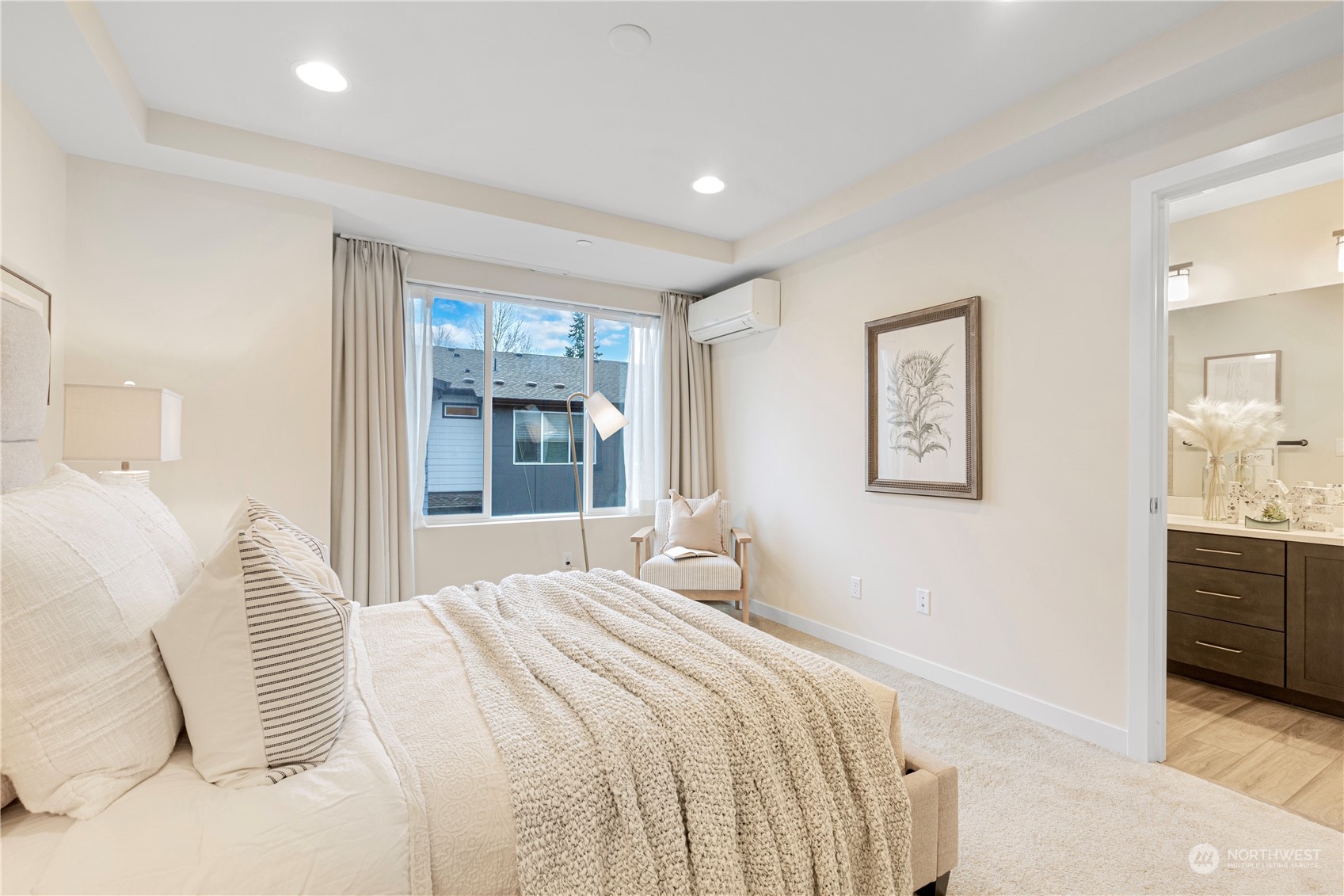23705 8th Drive Southeast, Unit C Bothell, WA 98021 - Photo 21 of 26 a bedroom with a large bed and a chandelier