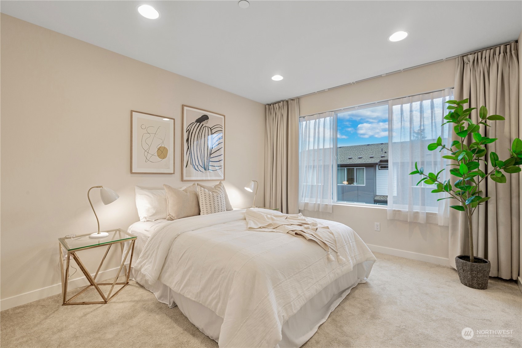 23705 8th Drive Southeast, Unit C Bothell, WA 98021 - Photo 23 of 26 a spacious bedroom with a bed and a potted plant