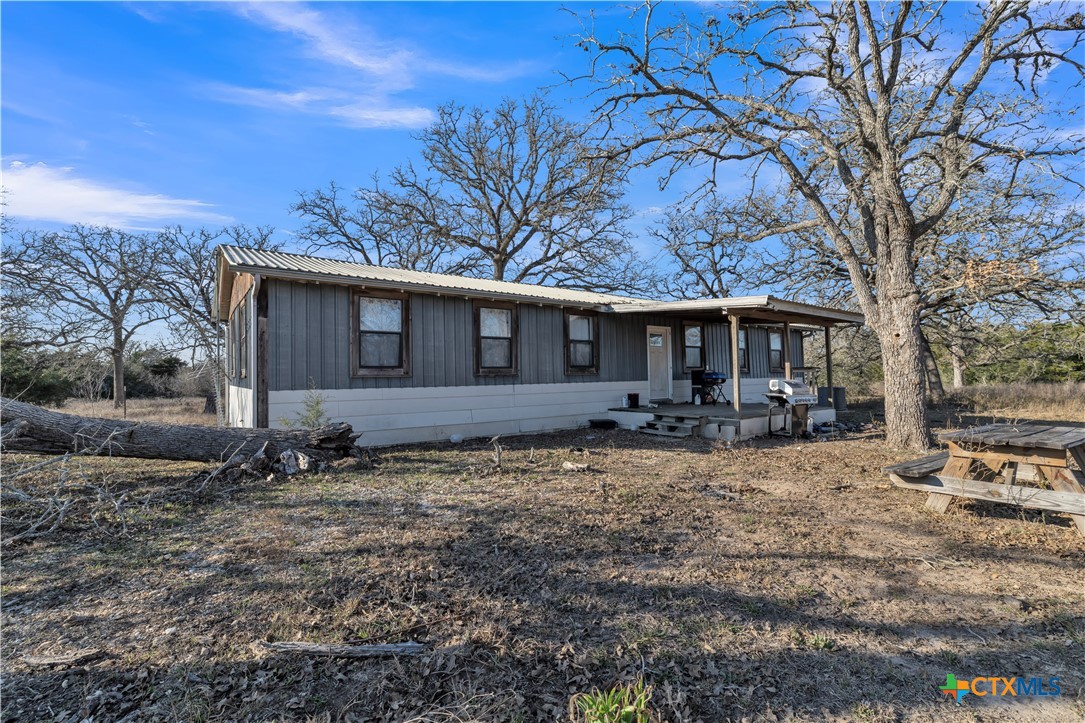 895 Patterson Road Flatonia, TX 78941 - Photo 2 of 21 a view of a house with yard and tree s