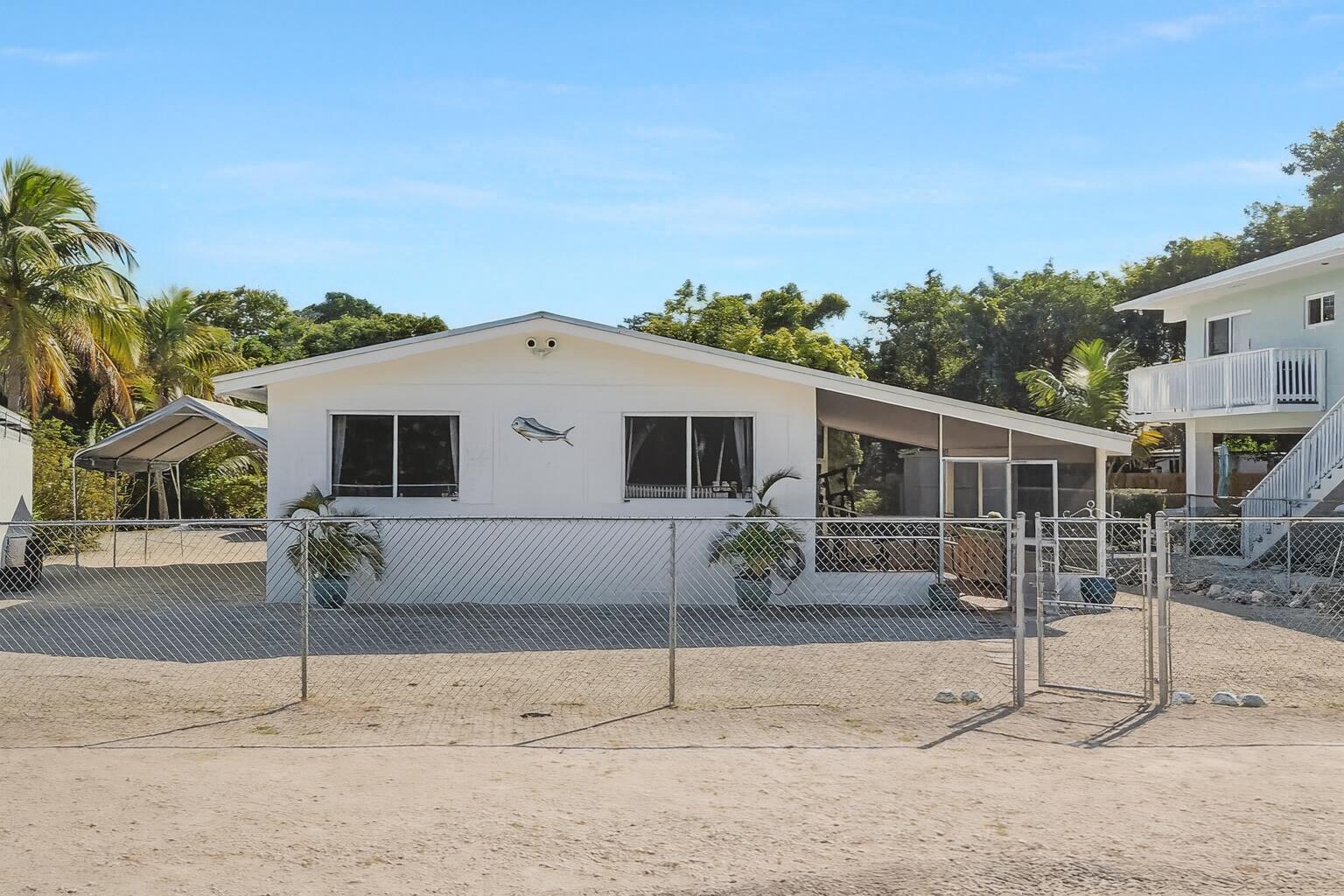 20 Palm Drive Key Largo, FL 33037 - Photo 2 of 47 a house with outdoor space