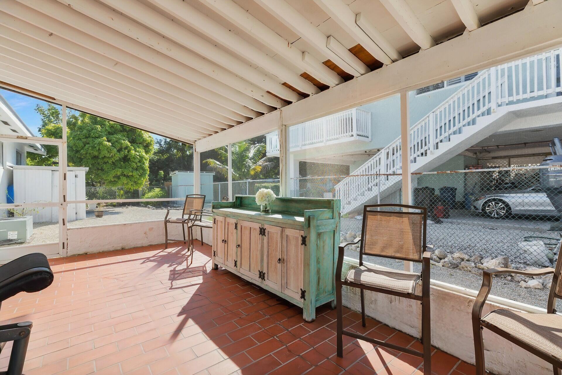 20 Palm Drive Key Largo, FL 33037 - Photo 21 of 47 a view of a porch with furniture